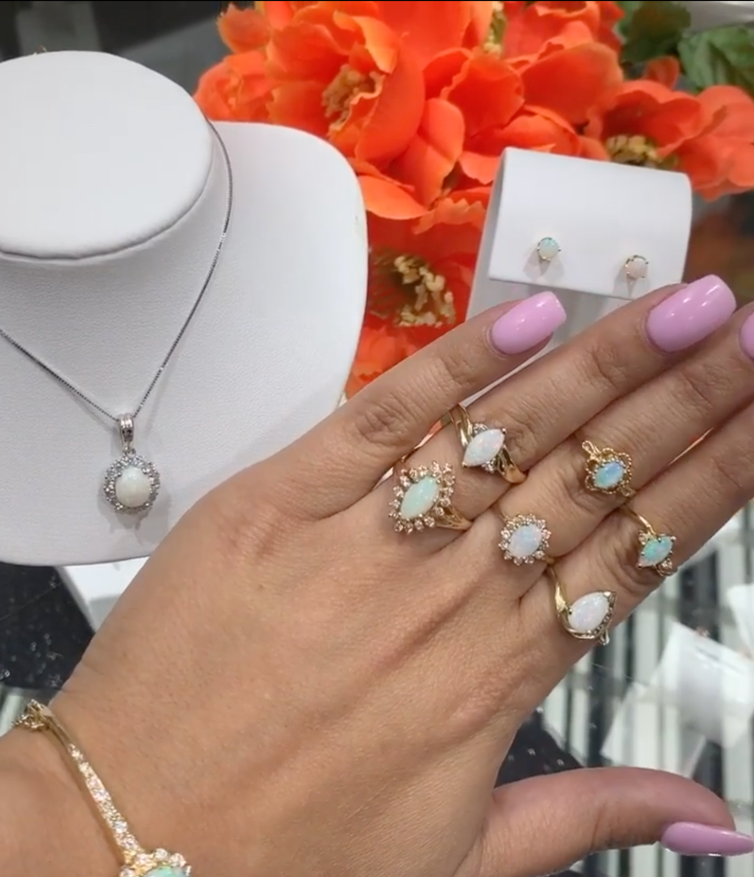 Opal jewelry collection rings on hand