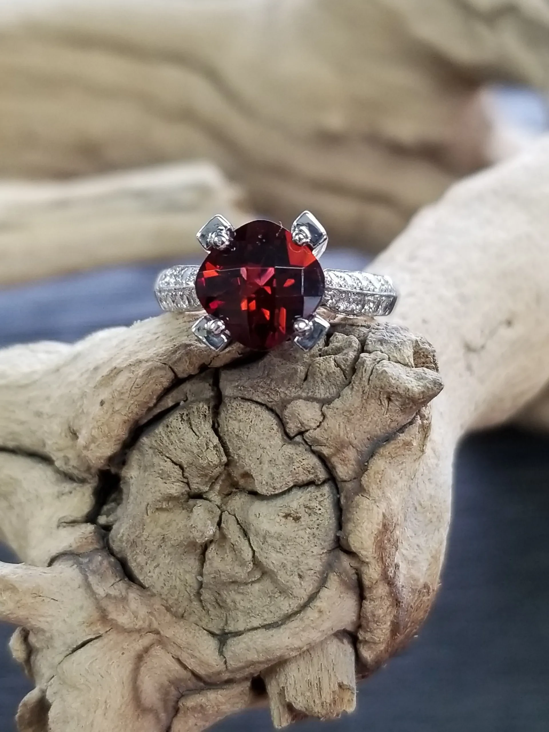 Ruby gemstone ring on driftwood