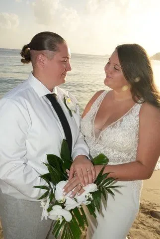 Happy couple on the beach on their wedding day